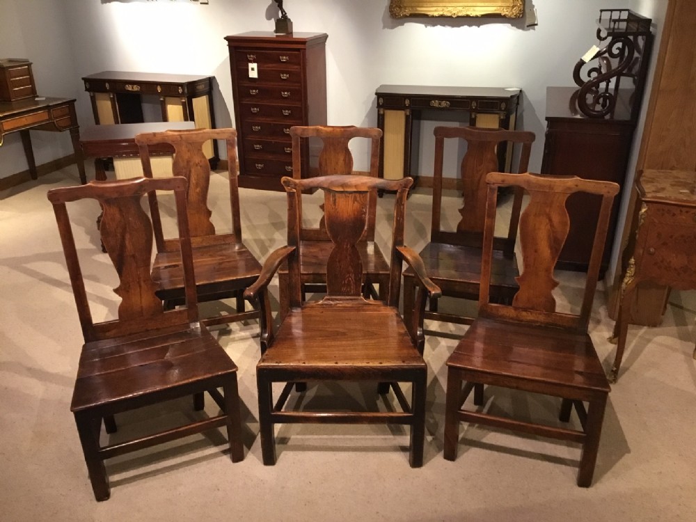 A matched set of 6 18th Century fruitwood country dining chairs