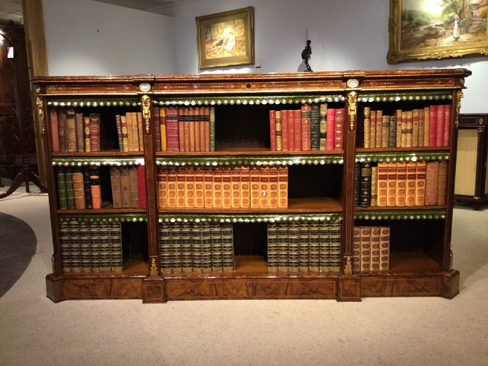 An Exhibition quality burr walnut, ormolu mounted and marquetry inlaid Victorian Period antique bookcase