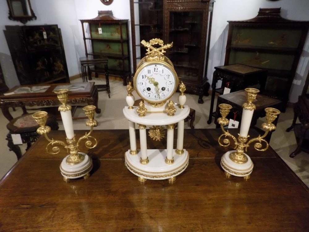 A French white marble & Ormolu clock garniture