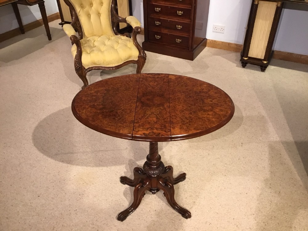 A burr walnut Victorian Period drop leaf Sutherland table