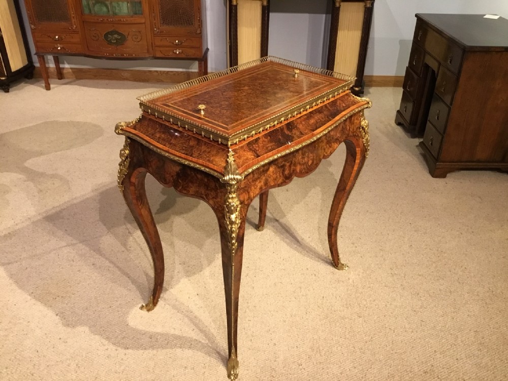 A stunning burr walnut, kingwood & ormolu mounted jardiniere/planter.