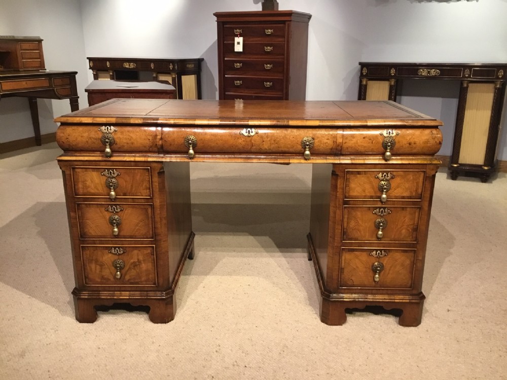 A George I Style walnut and burr walnut writing desk.