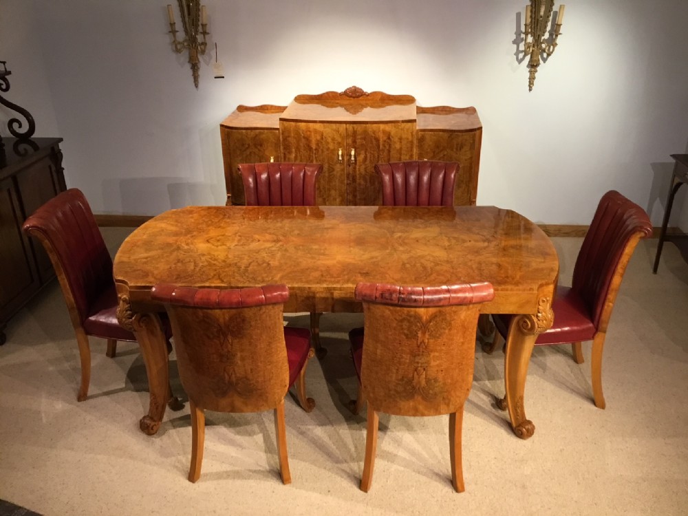 A superb burr walnut Art Deco Period dining suite 