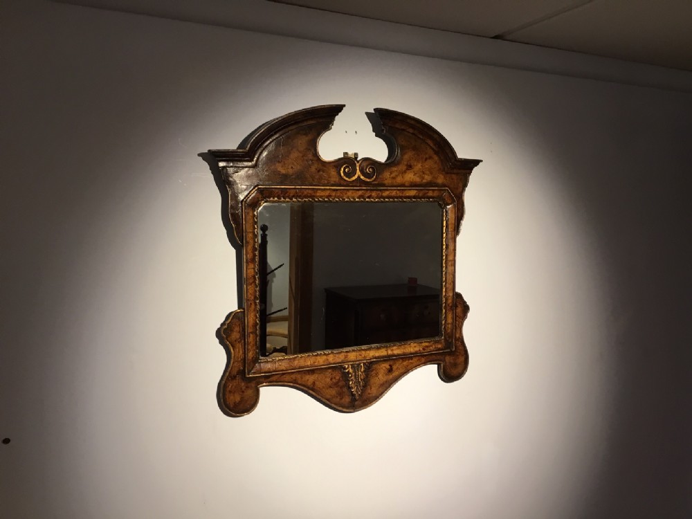 A George I Style walnut & parcel gilt wall mirror.
