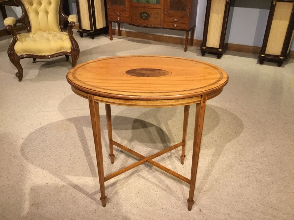 An Edwardian Period satinwood oval occasional table