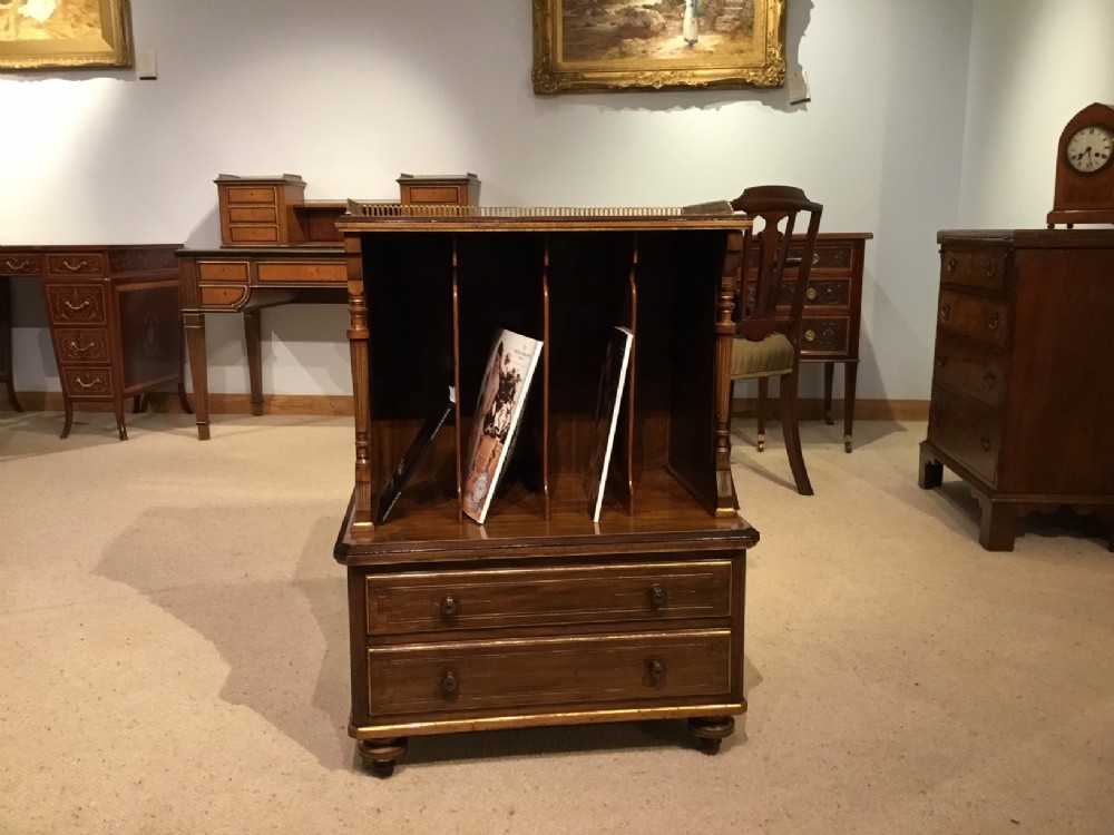 A Lambs Of Manchester walnut and parcel gilt antique Canterbury.