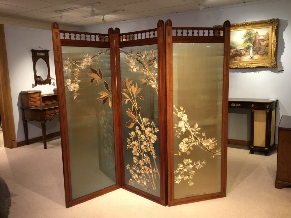 A walnut Victorian Aesthetic Period three fold vanity screen.