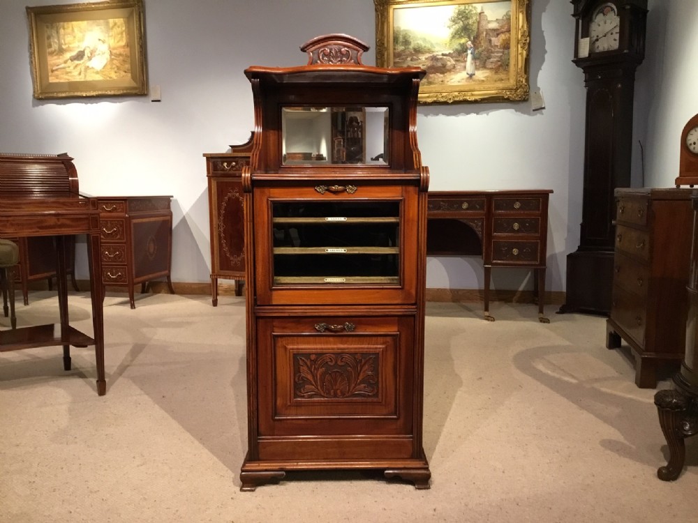 A walnut Late Victorian Period music cabinet