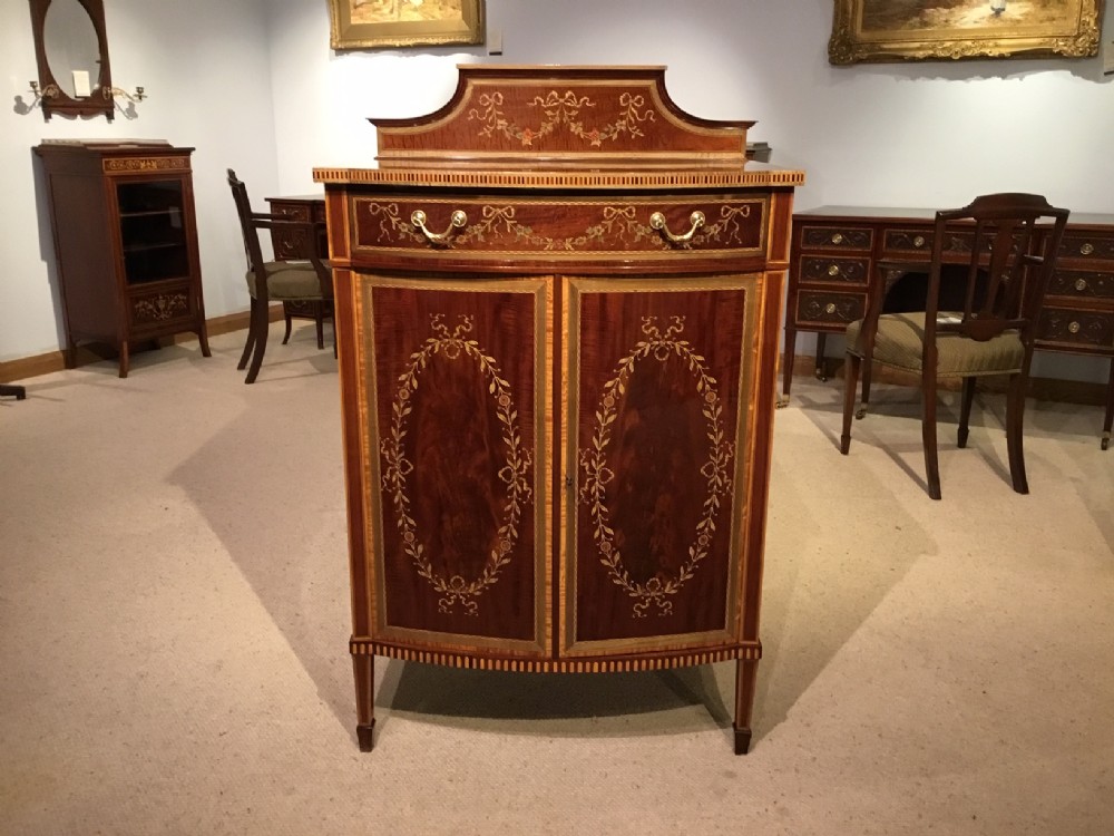 A Superb quality Edwards and Roberts marquetry inlaid antique music cabinet.