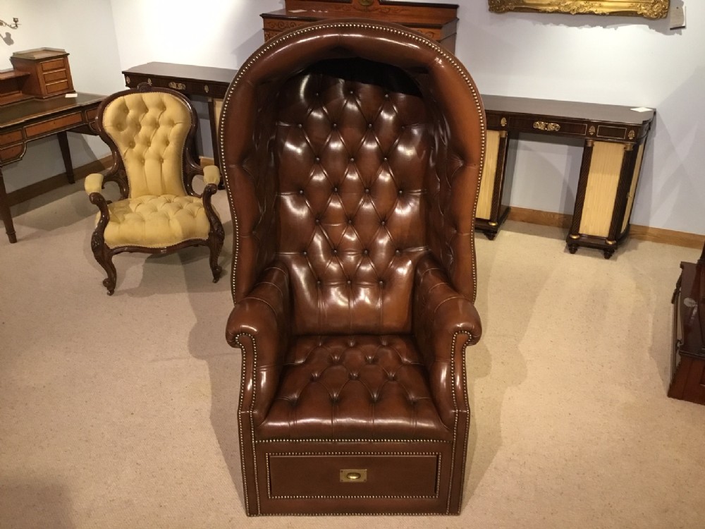 A brown leather 1920s Period  hall porters chair.