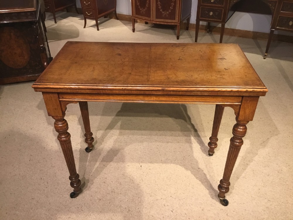 A Victorian Period Pollard oak fold over games table