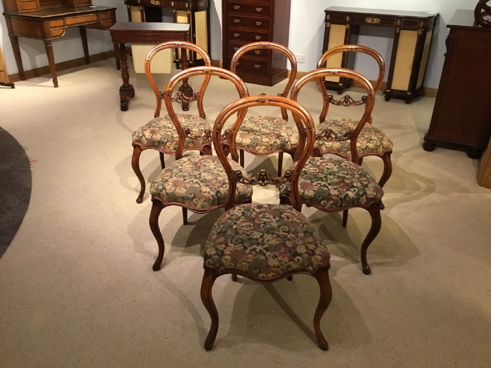 A good set of six walnut Victorian Period cabriole leg antique dining chairs