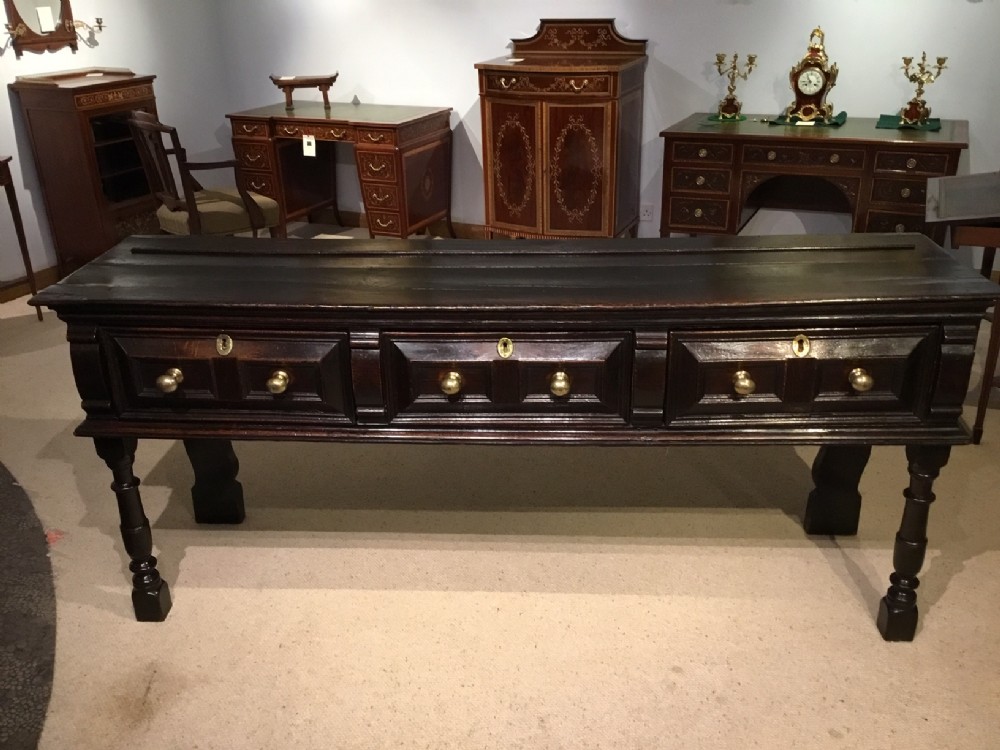 A dark oak Early 18th Century Antique dresser base