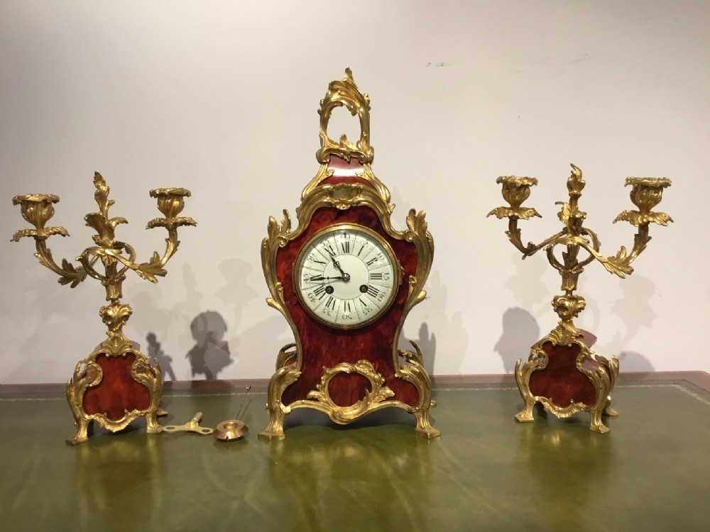 A beautiful Late 19th Century French tortoiseshell and ormolu clock garniture.
