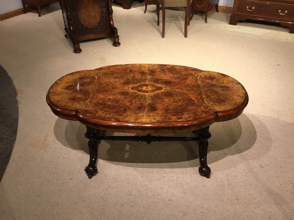 A beautiful shaped marquetry inlaid Victorian Period antique coffee table