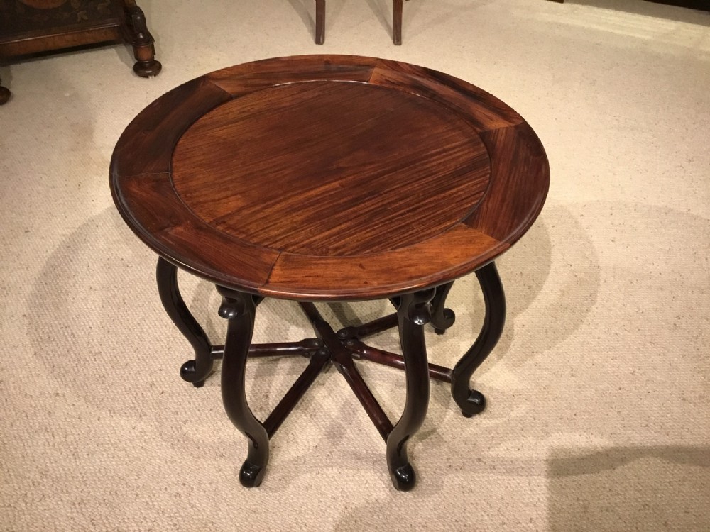 A circular hardwood Chinese antique coffee table