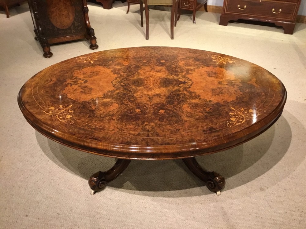 A fine quality burr walnut Victorian Period oval antique coffee table.