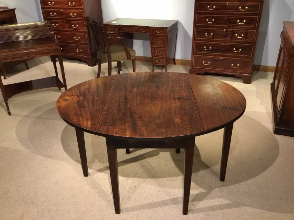 A mahogany George III Period Pembroke Table.