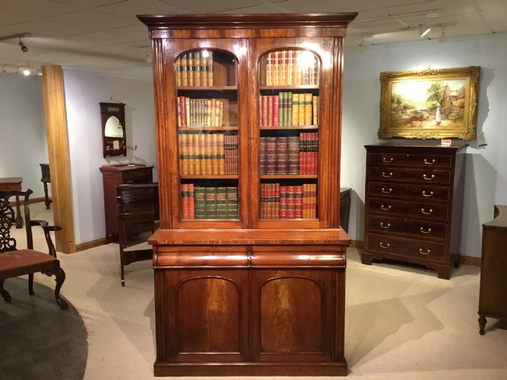 An Early Victorian Period flame mahogany antique bookcase