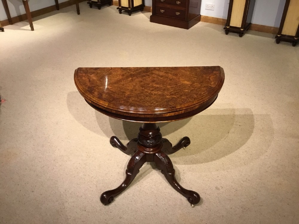 A burr walnut Victorian Period fold over card table