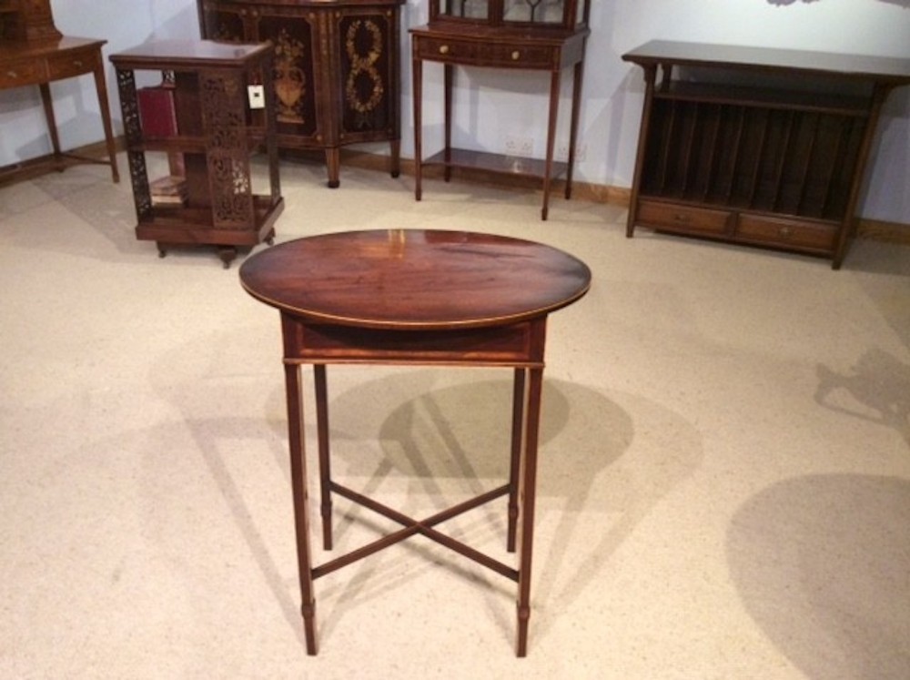 A mahogany late George III Period oval occasional table.