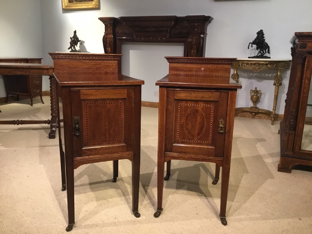 A pair of mahogany inlaid Edwardian Period bedside cabinets