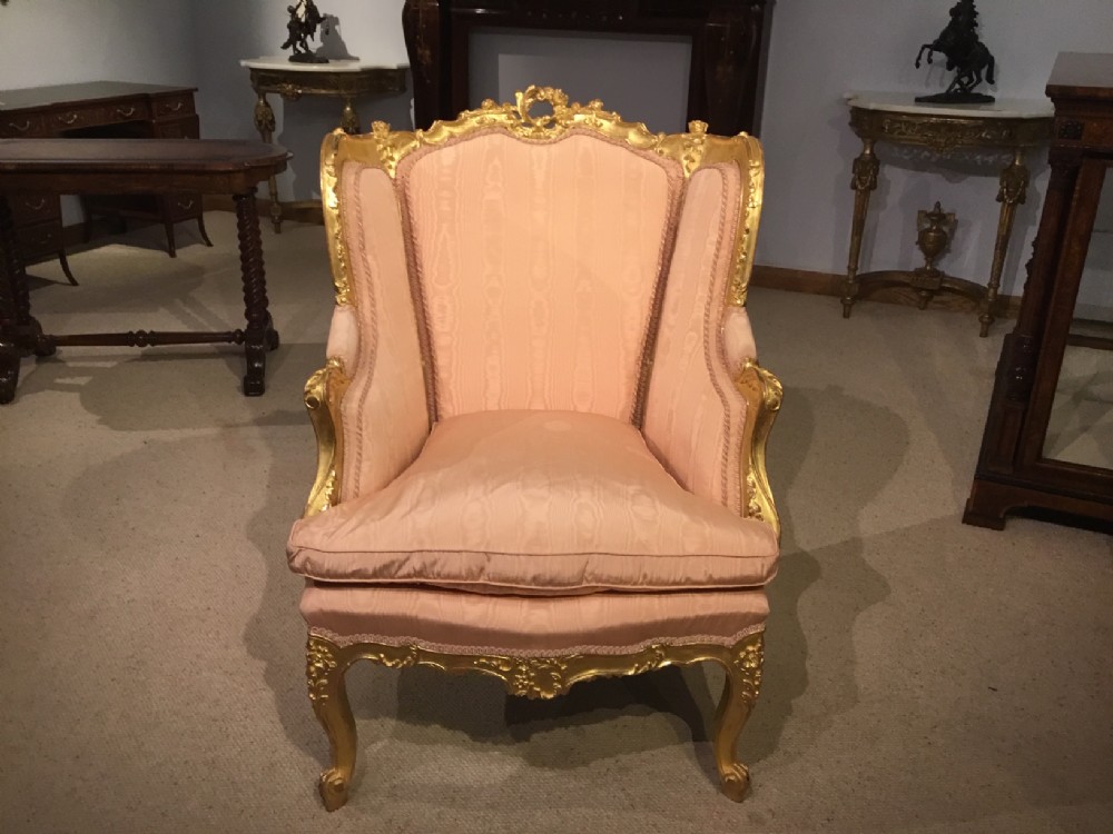 A Louis XVI Style Carved Gilt Wood Armchair