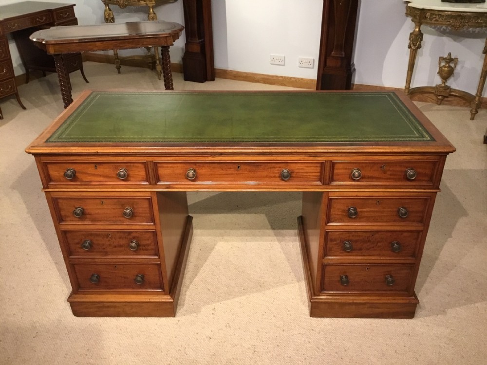 A Fine quality figured mahogany Victorian Period pedestal desk.