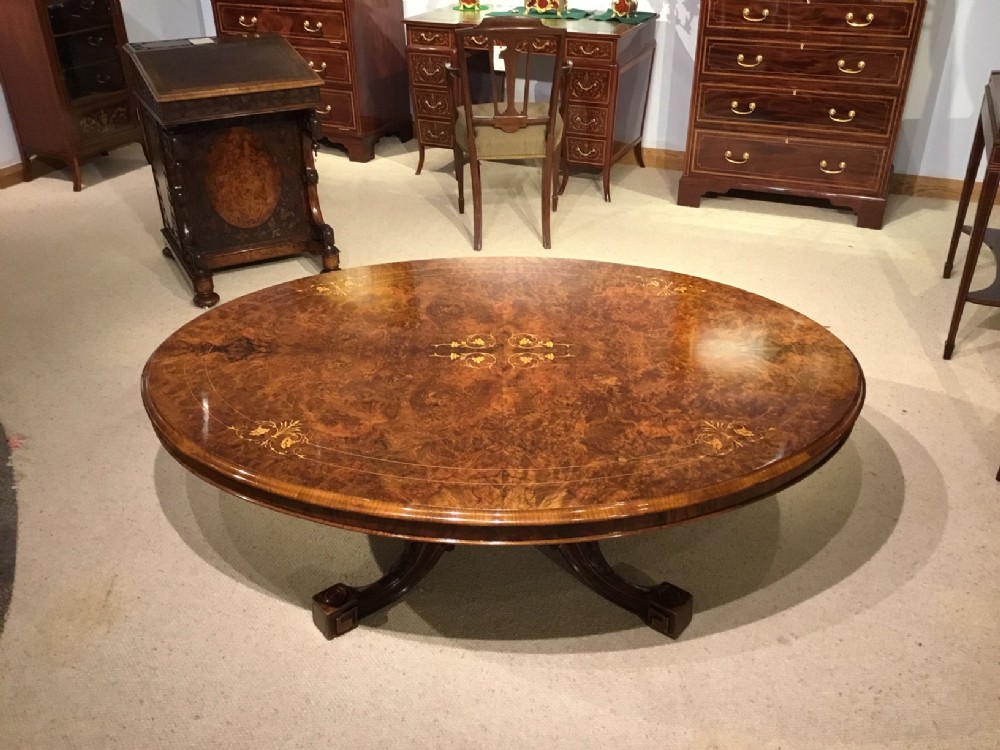 A large burr walnut Victorian Period antique oval coffee table.