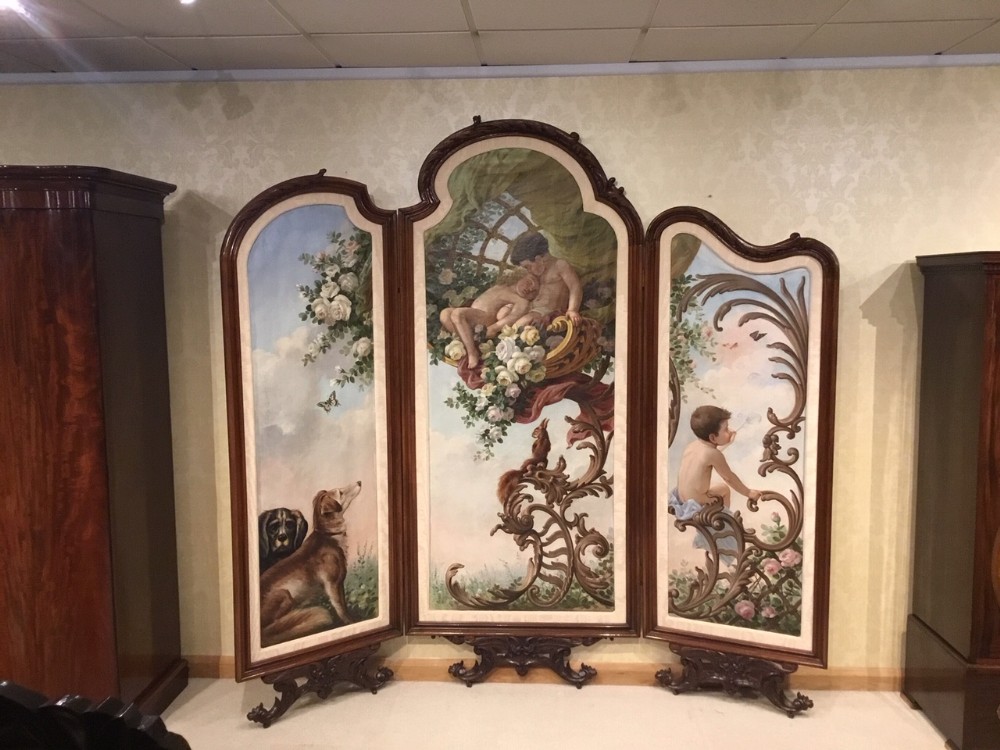 A large 19th Century French walnut three fold screen in the Rococo Style