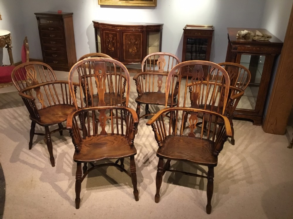 A lovely harlequin set of six 19th Century ash and elm antique Windsor armchairs.