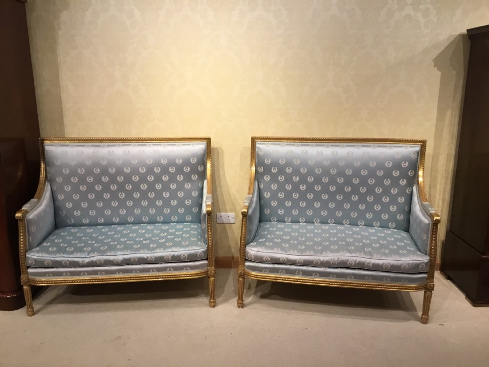 A good quality pair of carved gilt-wood French canapés.
