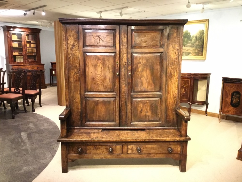 An extremely rare 18th Century ash and elm bacon settle.