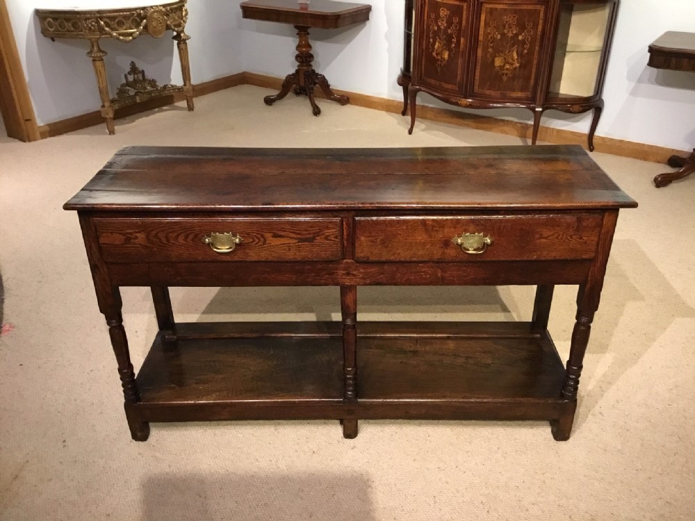 An oak Early 19th Century Two Drawer Dresser Base