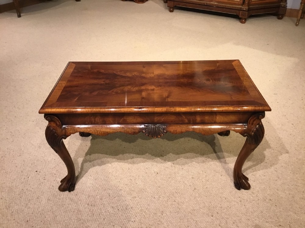 A 1920s Period figured walnut antique coffee table.