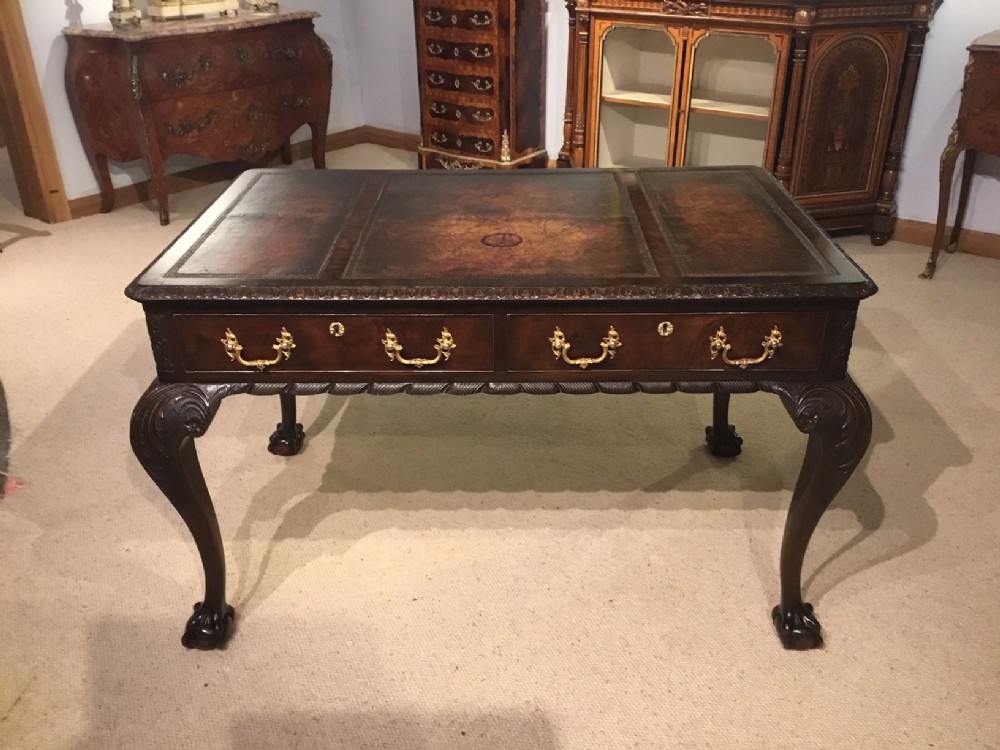 A mahogany Chippendale Revival writing table by Maple & Co Of London