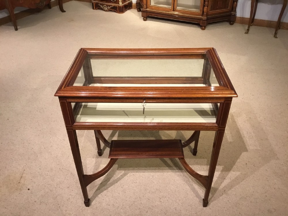 A mahogany inlaid Edwardian Period antique bijouterie cabinet