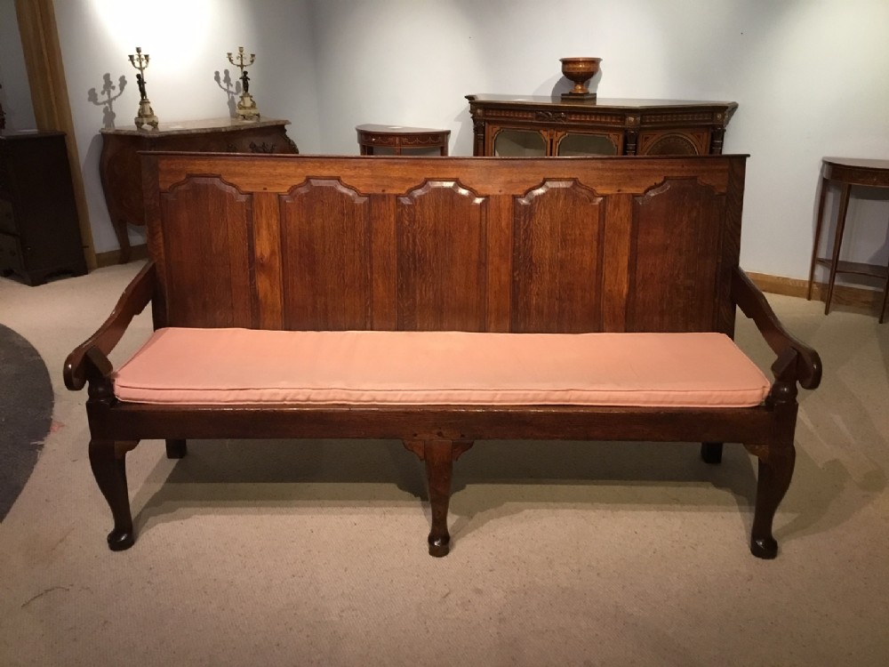 An oak George III Period five panelled settle