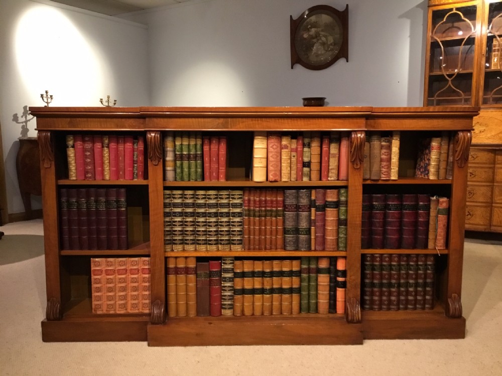 A fine quality figured walnut Victorian Period breakfront open bookcase