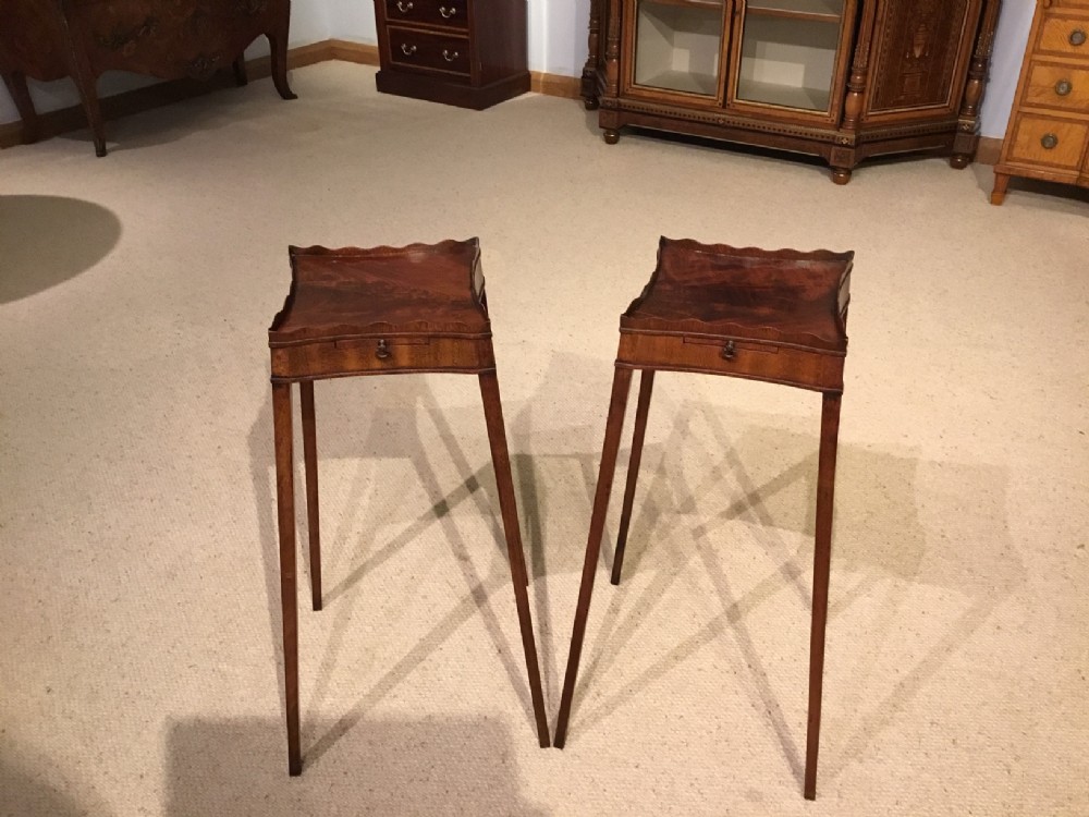 A pair of mahogany George III Style antique wine tables