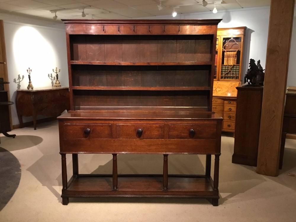 An oak late 18th Century antique pot board dresser and rack