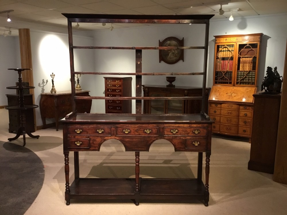 An oak and mahogany Early 19th Century antique dresser & rack