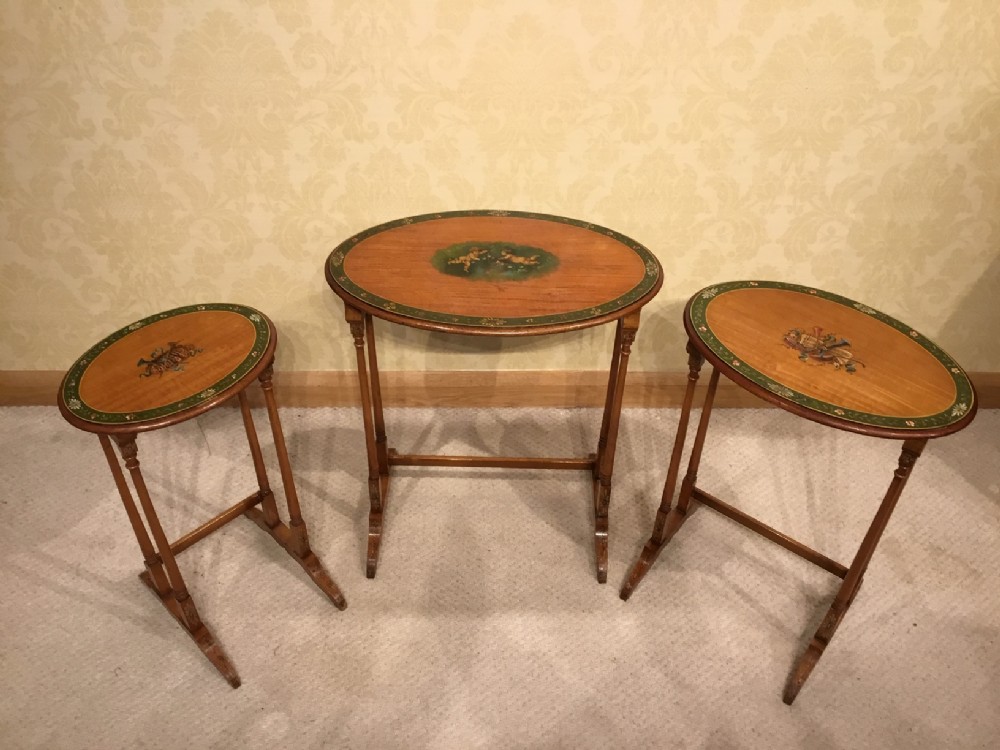 A beautiful Edwardian Period satinwood and polychrome decorated nest of three tables