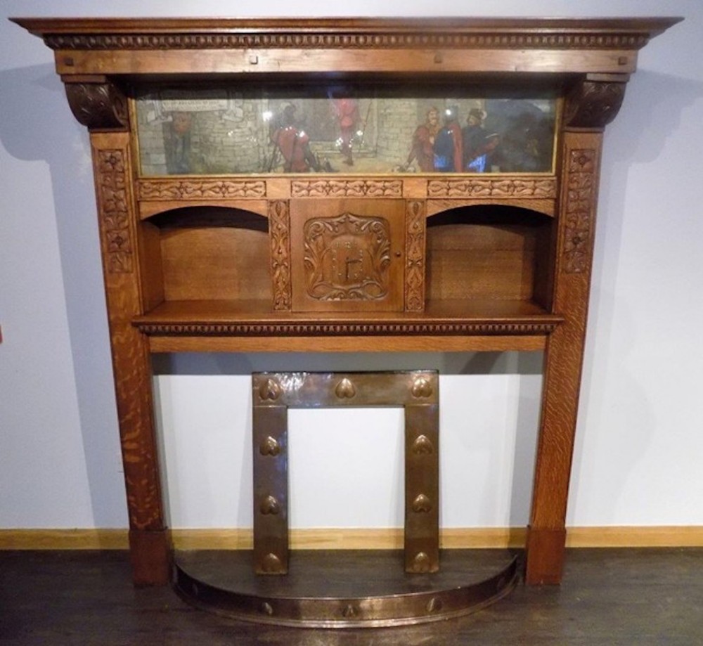 A magnificent and rare Arts & Crafts Period oak fireplace probably by Edgar Wood