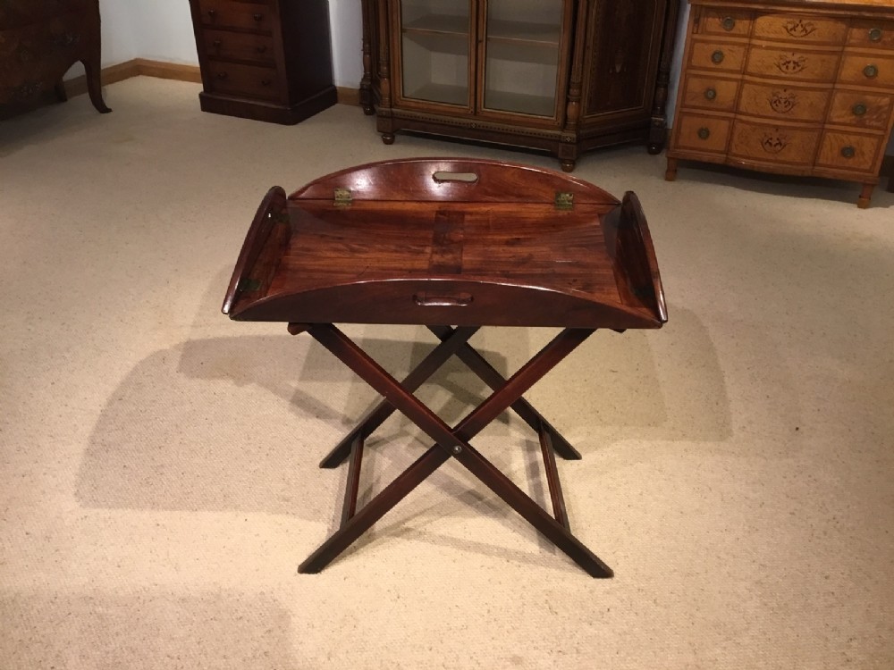A mahogany Regency Period antique butlers tray on stand