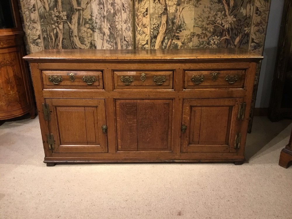 A narrow oak Georgian Period antique dresser base