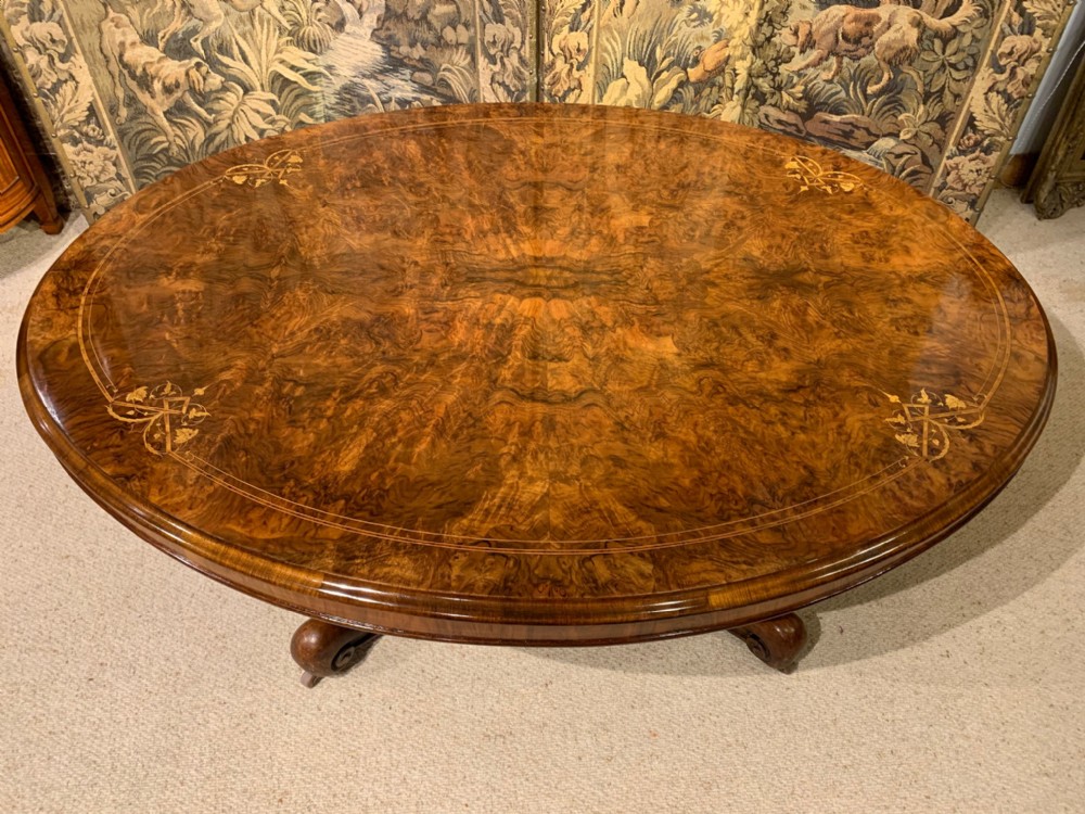A Victorian Period burr walnut oval antique coffee table