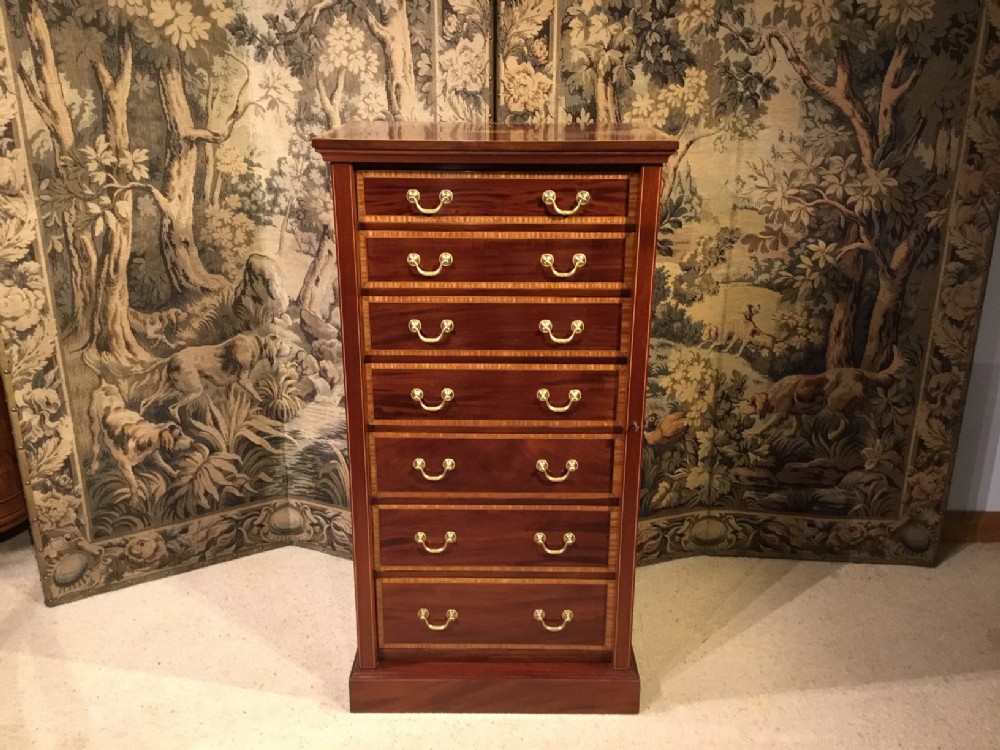 A mahogany inlaid  Edwardian Period antique wellington chest.