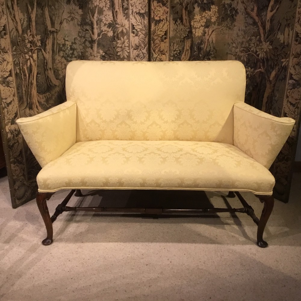 A walnut George II Style love seat