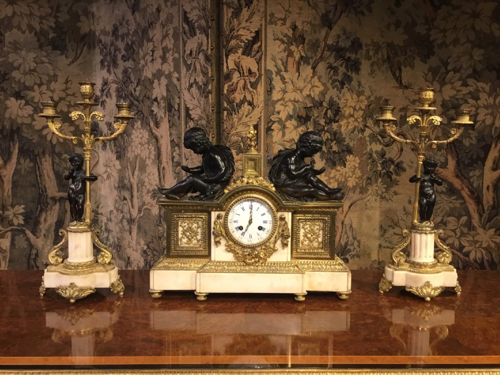 A Late 19th Century marble, bronze and Ormolu French clock garniture